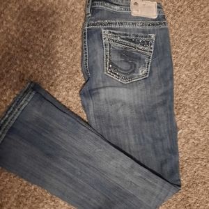 Distressed silver jeans